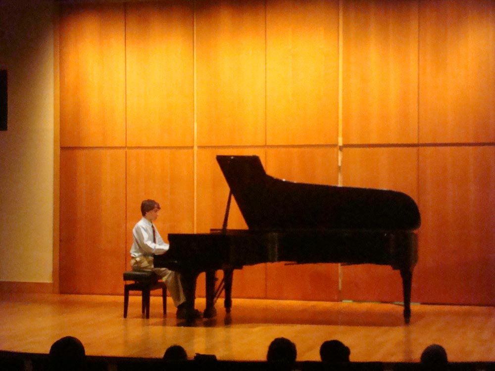 Alexander performing piano music by Ernst Mahle in Rock Hall, Philadelphia